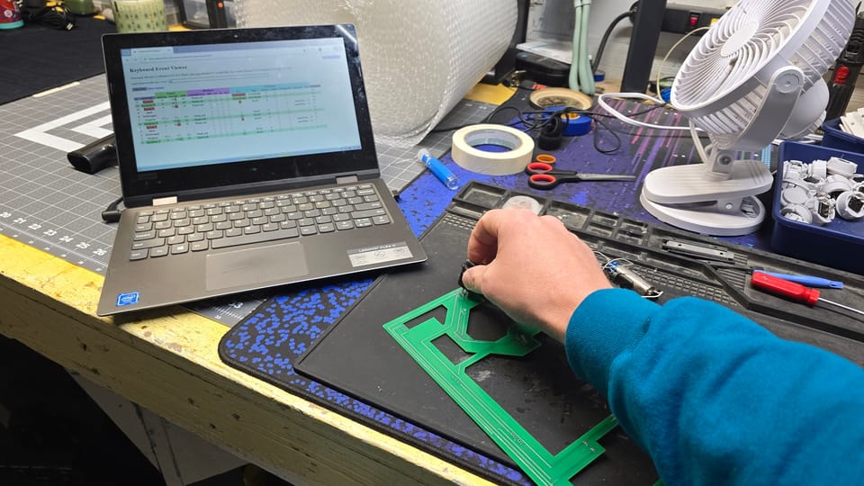 Testing a control box board on a laptop that shows each key press as it happens